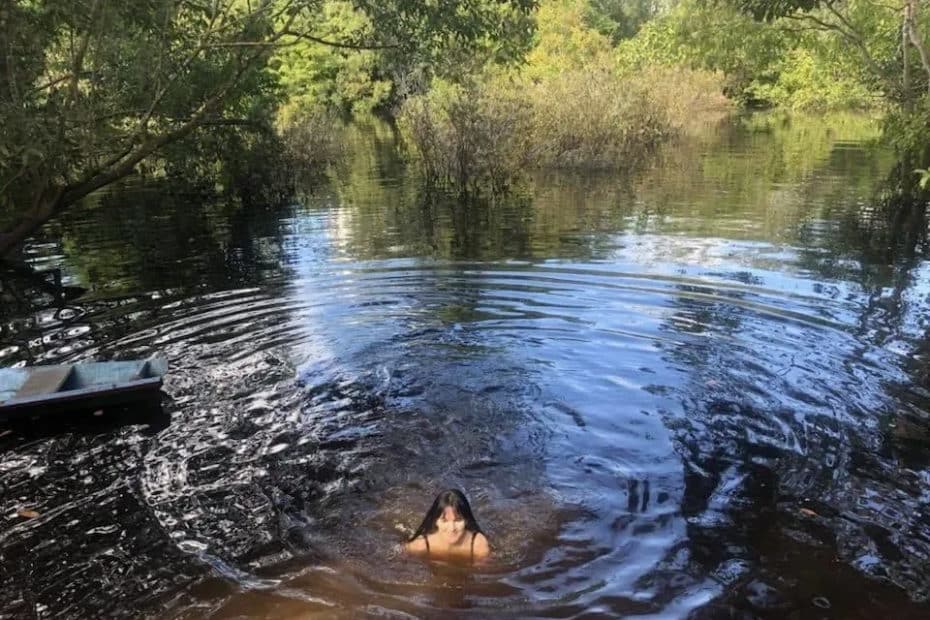 Dr Lani Roy swimming in the Amazon River